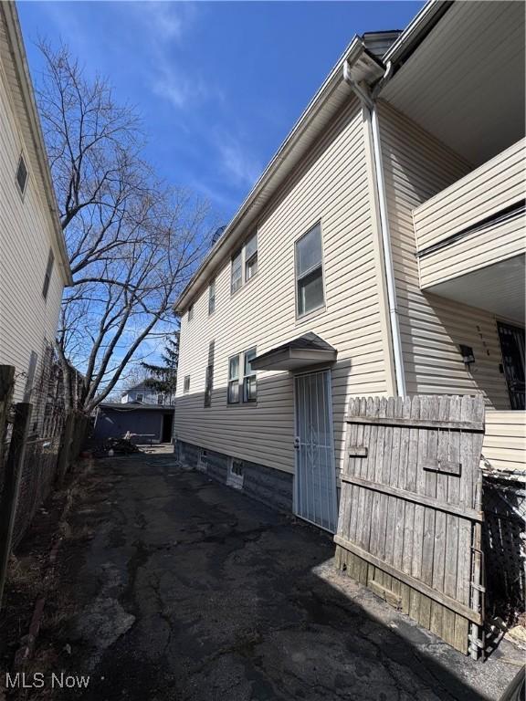 2786 E 119th St, Cleveland, OH 44120 - view of property exterior featuring a balcony and fence