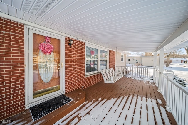 view of snow covered deck