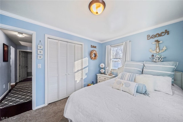 carpeted bedroom with ornamental molding and a closet