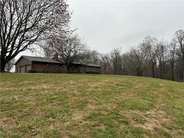 view of yard featuring a garage