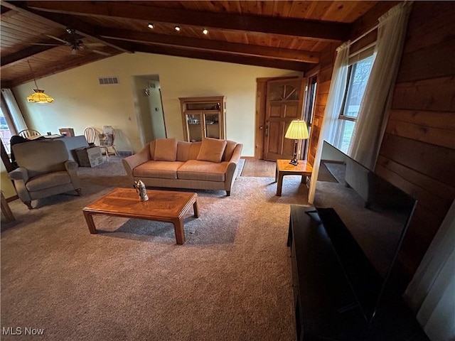 living room with vaulted ceiling with beams, wooden ceiling, ceiling fan, and carpet flooring