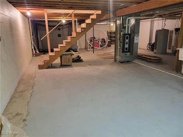 basement with heating unit and electric water heater