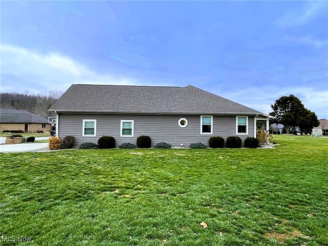 view of home's exterior featuring a lawn