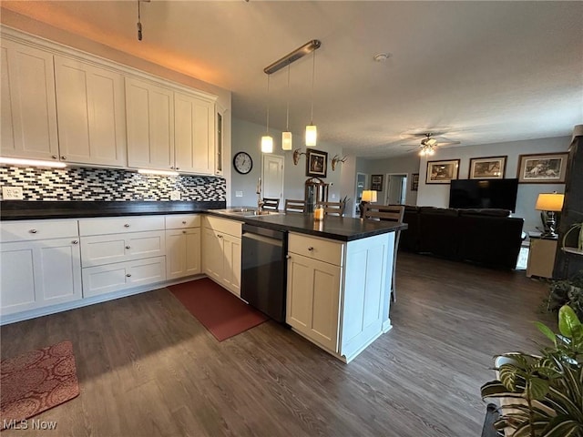 kitchen featuring decorative light fixtures, dark hardwood / wood-style flooring, dishwasher, kitchen peninsula, and white cabinets