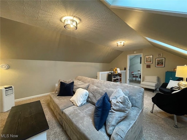 carpeted bedroom with vaulted ceiling and a textured ceiling