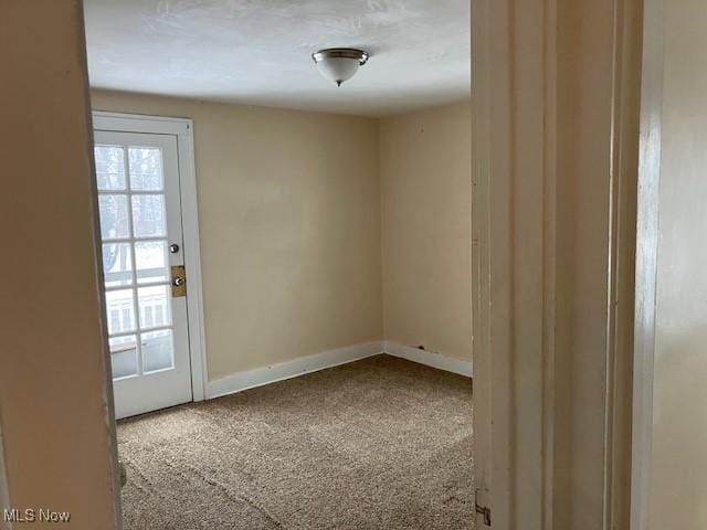 spare room featuring carpet flooring