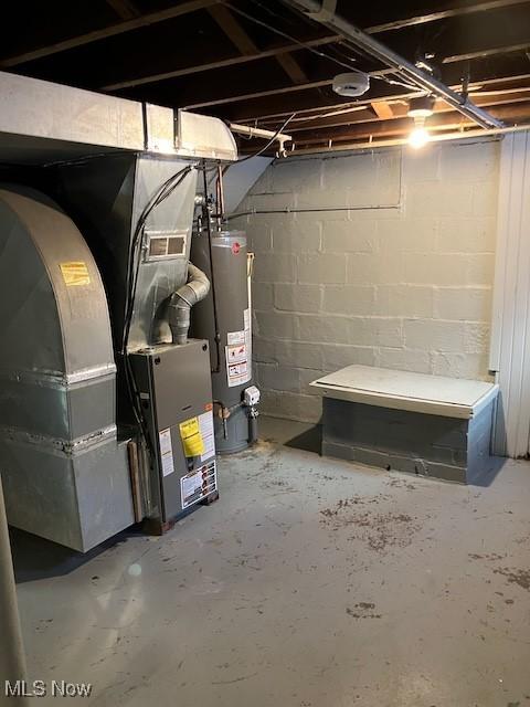 basement featuring heating unit and gas water heater