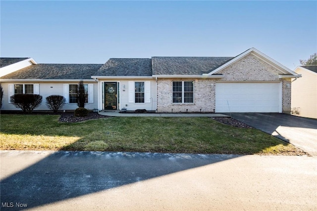 single story home with a garage and a front lawn