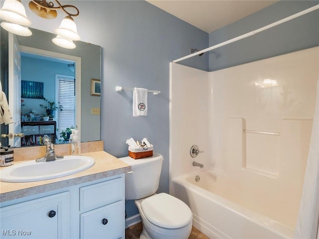 full bathroom featuring vanity, bathing tub / shower combination, and toilet