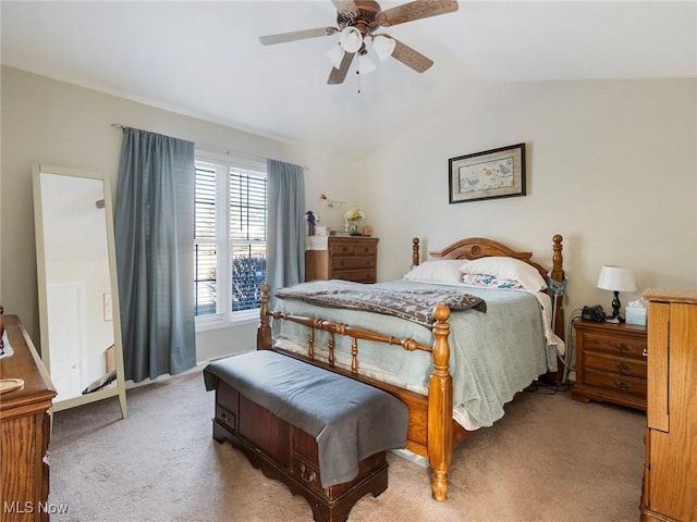 carpeted bedroom featuring ceiling fan and lofted ceiling