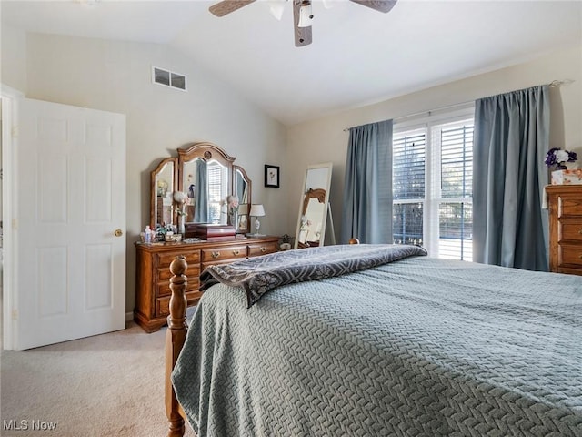 carpeted bedroom with vaulted ceiling and ceiling fan