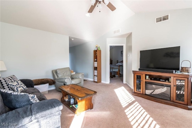 living room with ceiling fan, light colored carpet, and lofted ceiling