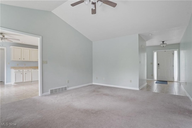 9278 Woodworth Rd Unit 1801, North Lima, OH 44452 - unfurnished living room featuring ceiling fan, light colored carpet, lofted ceiling, and baseboards