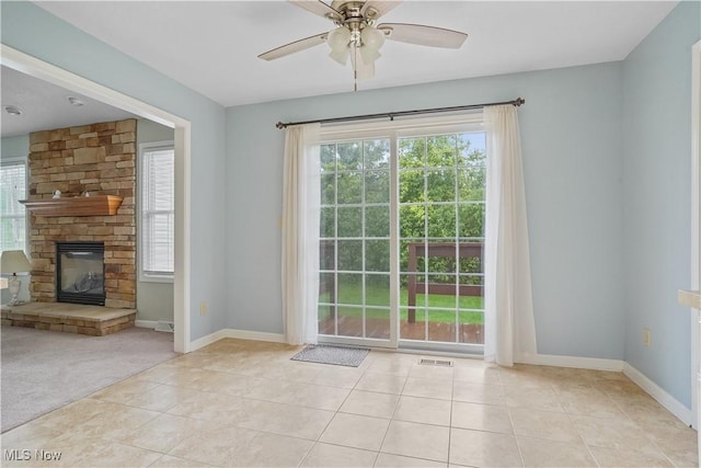 9278 Woodworth Rd Unit 1801, North Lima, OH 44452 - doorway featuring healthy amount of natural light, a ceiling fan, tile patterned flooring, and a fireplace