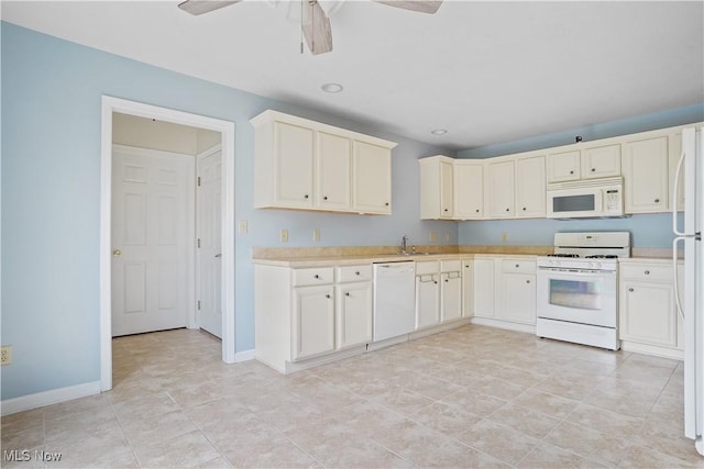 9278 Woodworth Rd Unit 1801, North Lima, OH 44452 - kitchen with white appliances, light countertops, ceiling fan, baseboards, and a sink