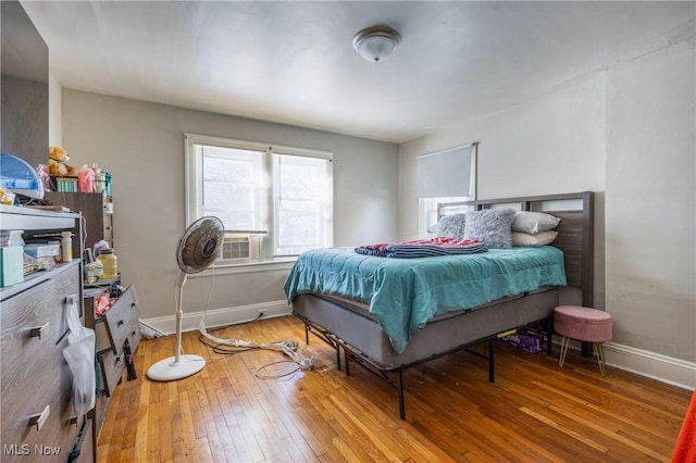 bedroom featuring cooling unit and wood-type flooring