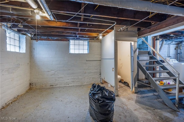 basement featuring washer / dryer and plenty of natural light