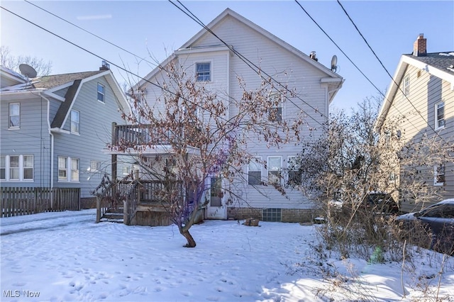 view of snow covered house