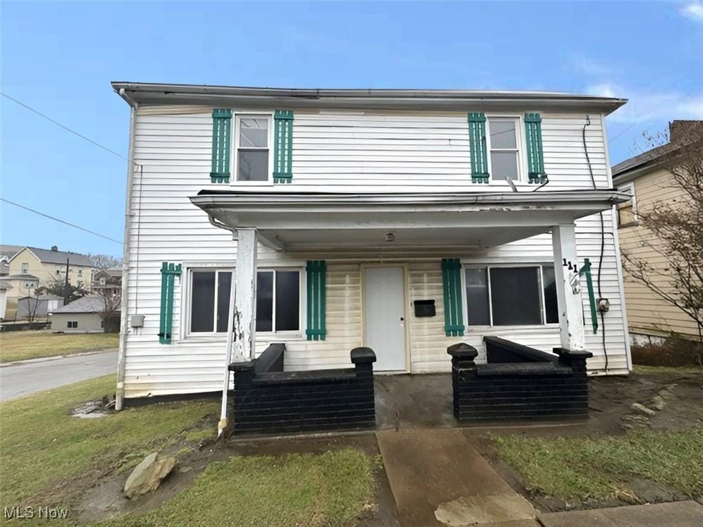 view of front of property featuring covered porch