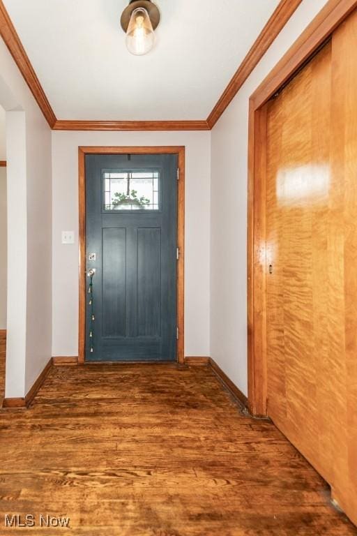 entrance foyer featuring crown molding and hardwood / wood-style floors