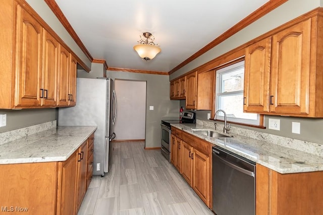 kitchen featuring crown molding, appliances with stainless steel finishes, light stone countertops, and sink