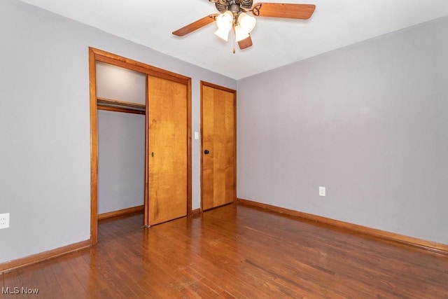 unfurnished bedroom featuring hardwood / wood-style floors and ceiling fan