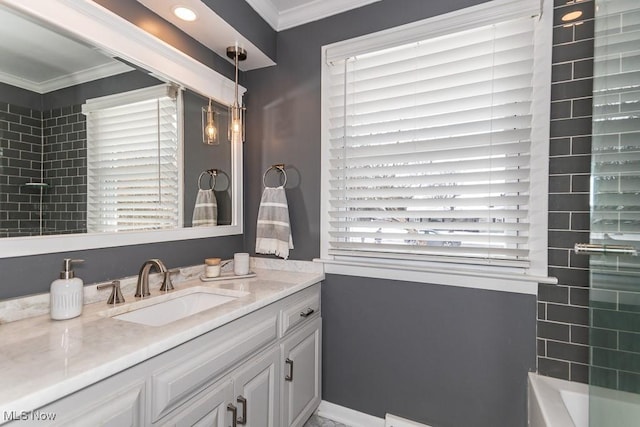 bathroom with ornamental molding and vanity