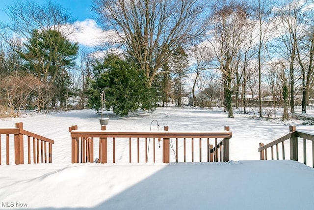 view of snow covered deck