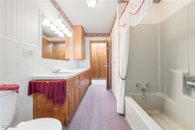 full bathroom with vanity, toilet, shower / bathing tub combination, and tile walls