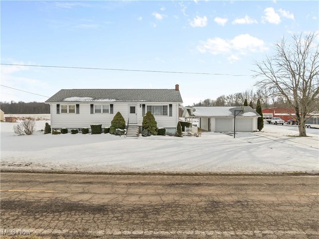 view of front of home with an outbuilding and a garage