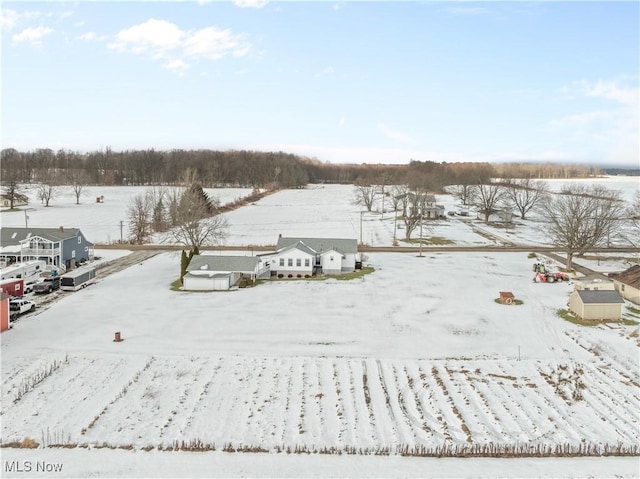 snowy aerial view featuring a rural view