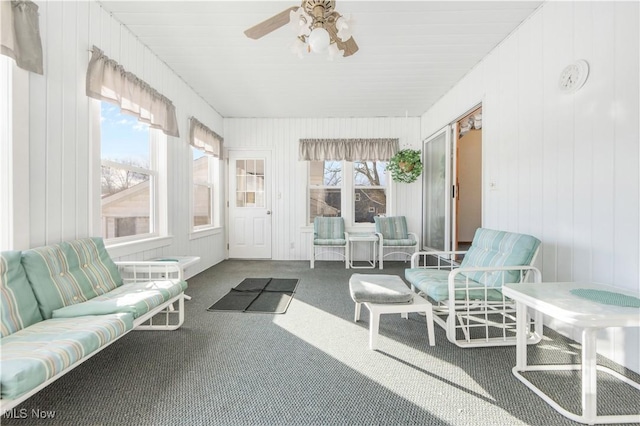 sunroom / solarium with ceiling fan and a healthy amount of sunlight