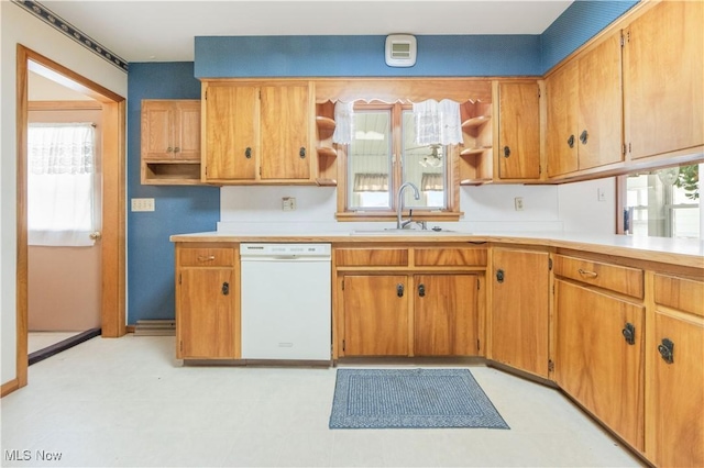 kitchen featuring white dishwasher and sink