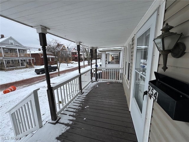 view of snow covered deck