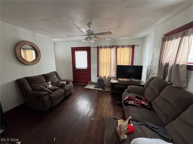 living room with ceiling fan and dark hardwood / wood-style floors