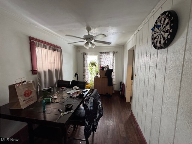 dining space featuring dark wood-type flooring and ceiling fan