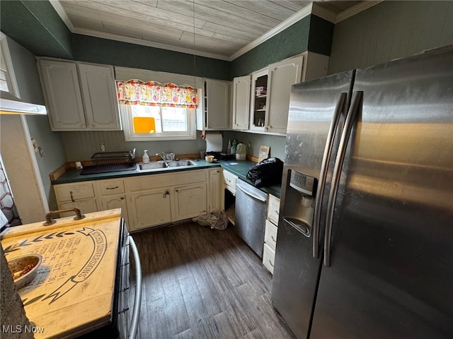 kitchen featuring crown molding, white cabinets, and appliances with stainless steel finishes