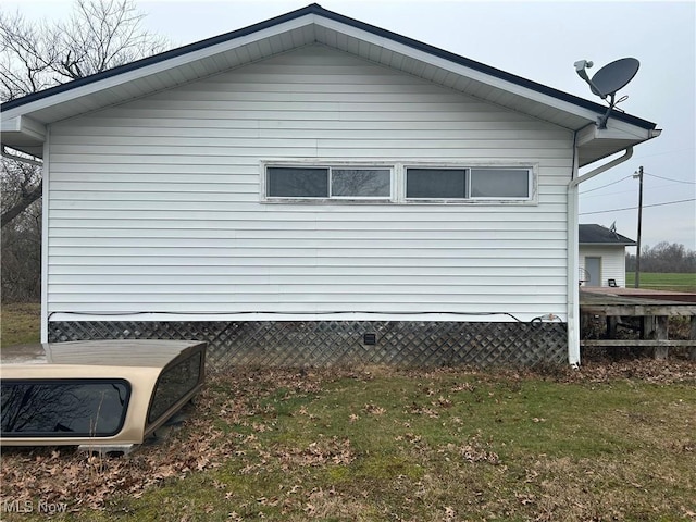 view of property exterior featuring a yard