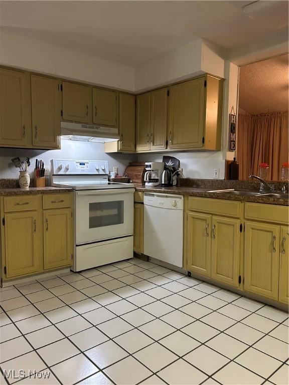 kitchen with white appliances and sink