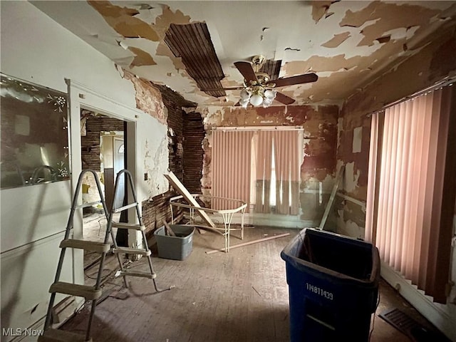 miscellaneous room featuring ceiling fan and hardwood / wood-style floors