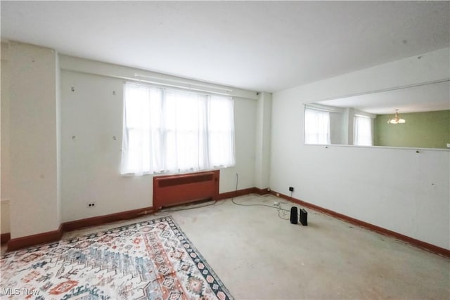 empty room featuring radiator heating unit