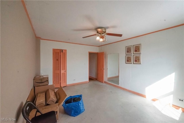 interior space featuring ornamental molding and ceiling fan