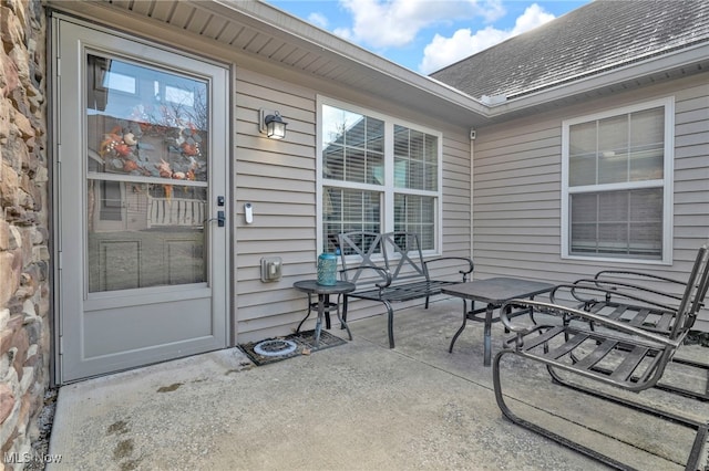 property entrance featuring a patio area