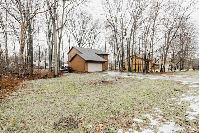 view of yard featuring a garage