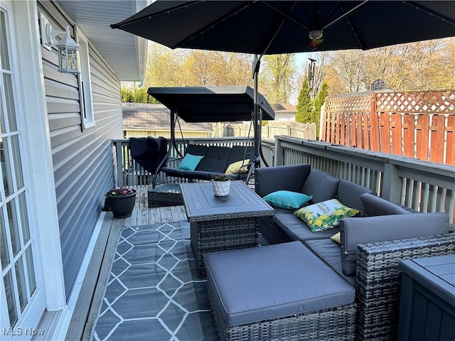 wooden terrace featuring an outdoor hangout area