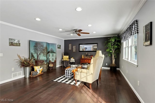 living room with crown molding, ceiling fan, and dark hardwood / wood-style floors