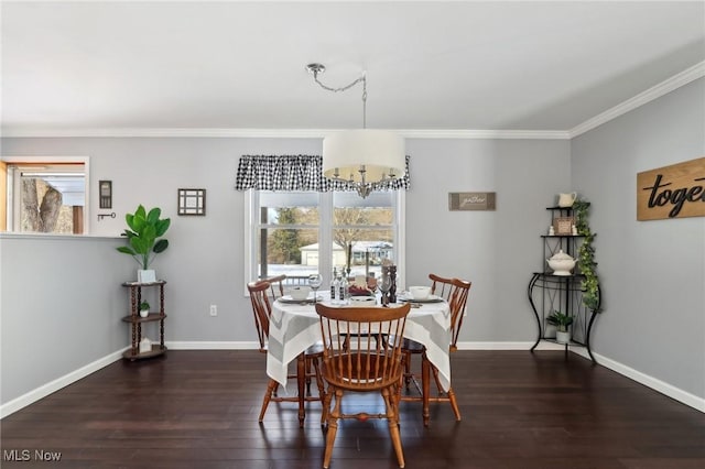 dining area with crown molding, dark hardwood / wood-style flooring, and a notable chandelier