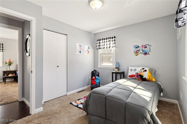 carpeted bedroom with a closet