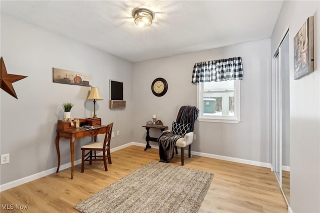 living area with light hardwood / wood-style floors