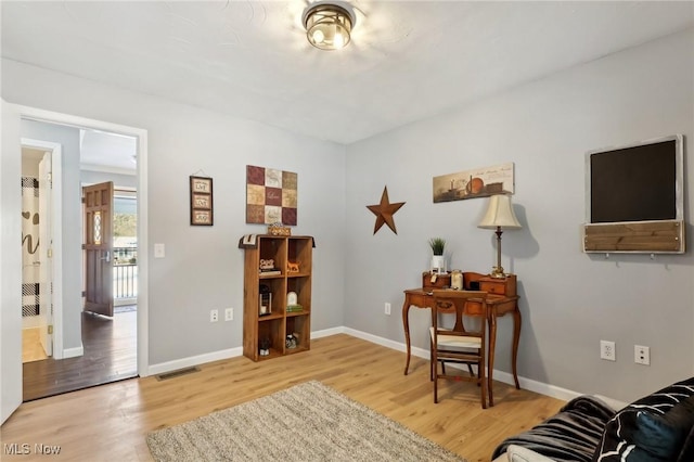 sitting room with light wood-type flooring